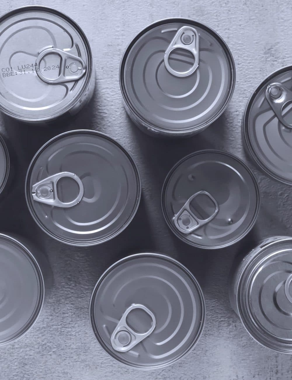 Unlabelled food tins seen from above